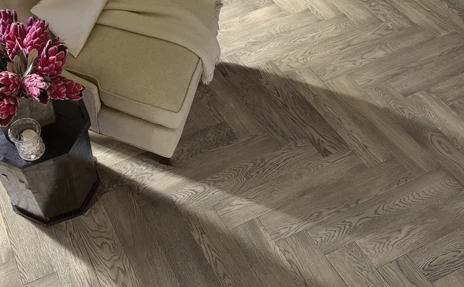 herringbone grey toned hardwood flooring in living room